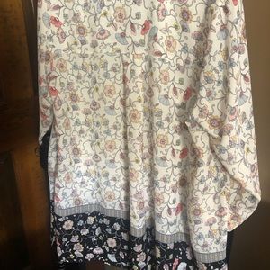 Silky top wears past butt.3/4 length sleeves.